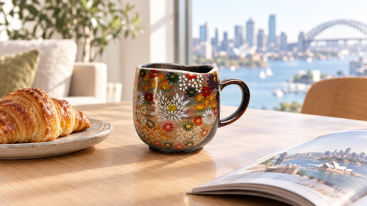 Kutani Hanazume mug on a timber table with a croissant and magazine in a bright Sydney apartment