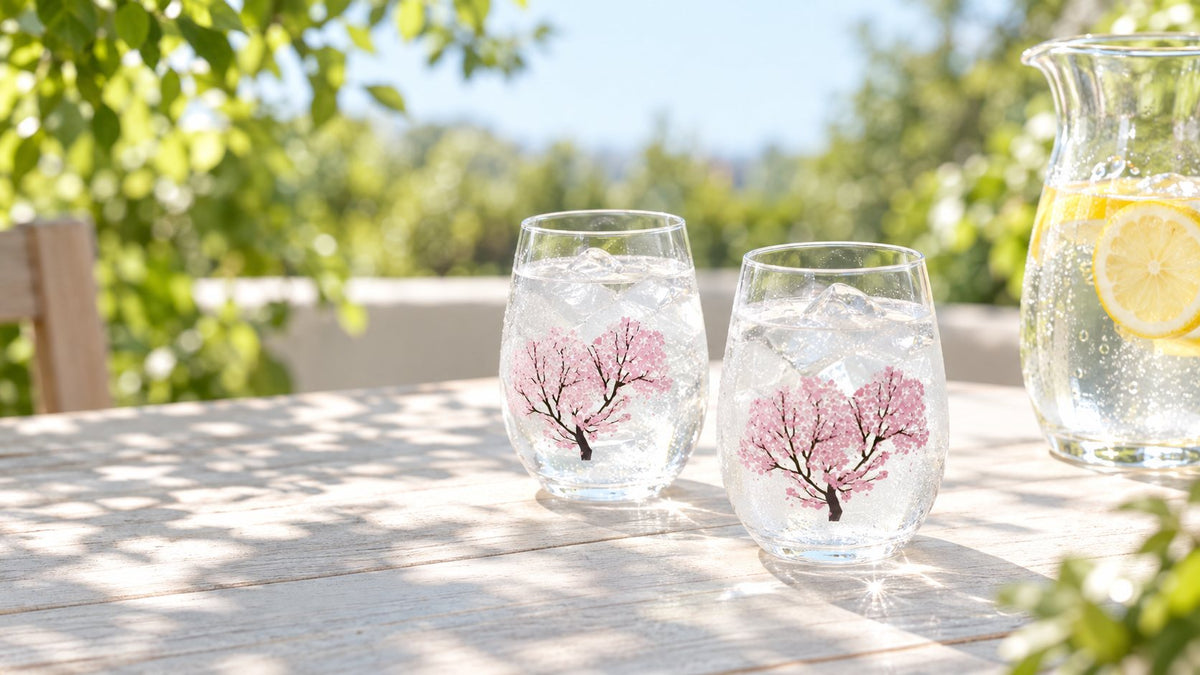 Chill Bloom Sakura colour-changing glasses of iced water on a sunny outdoor table