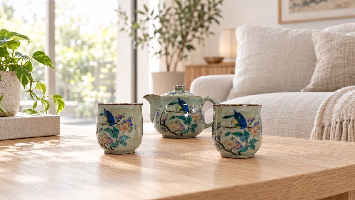 Kutsurogi Kutani flower and bird tea set on an oak coffee table in a bright Australian living room